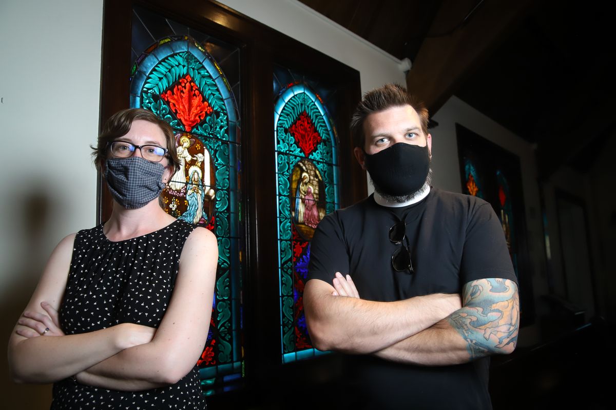 The Rev. Katy Shedlock, who is the West Central Abbey minister and member of Creator’s Table, and the Rev. Jonathan Meyers, who is an Episcopal Diocese vicar and also a member of Creator’s Table, stand for a portrait Monday in the historic Trinity Chapel at West Central Abbey in Spokane.   (Libby Kamrowski/The Spokesman-Review)