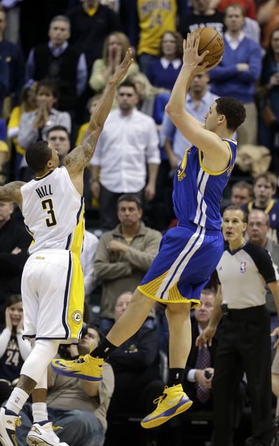 Golden State’s Klay Thompson, who had 26 points, hoists game-winning shot over George Hill to beat Indiana 98-96. (Associated Press)