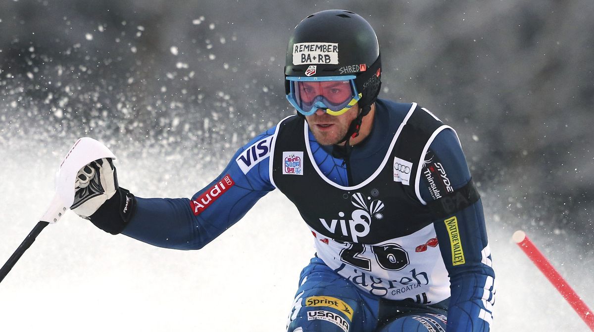 David Chodounsky, of the U.S., wears a black armband and a sticker on his helmet bearing the initials of two teammates who died Monday in an avalanche in Austria. (Associated Press)