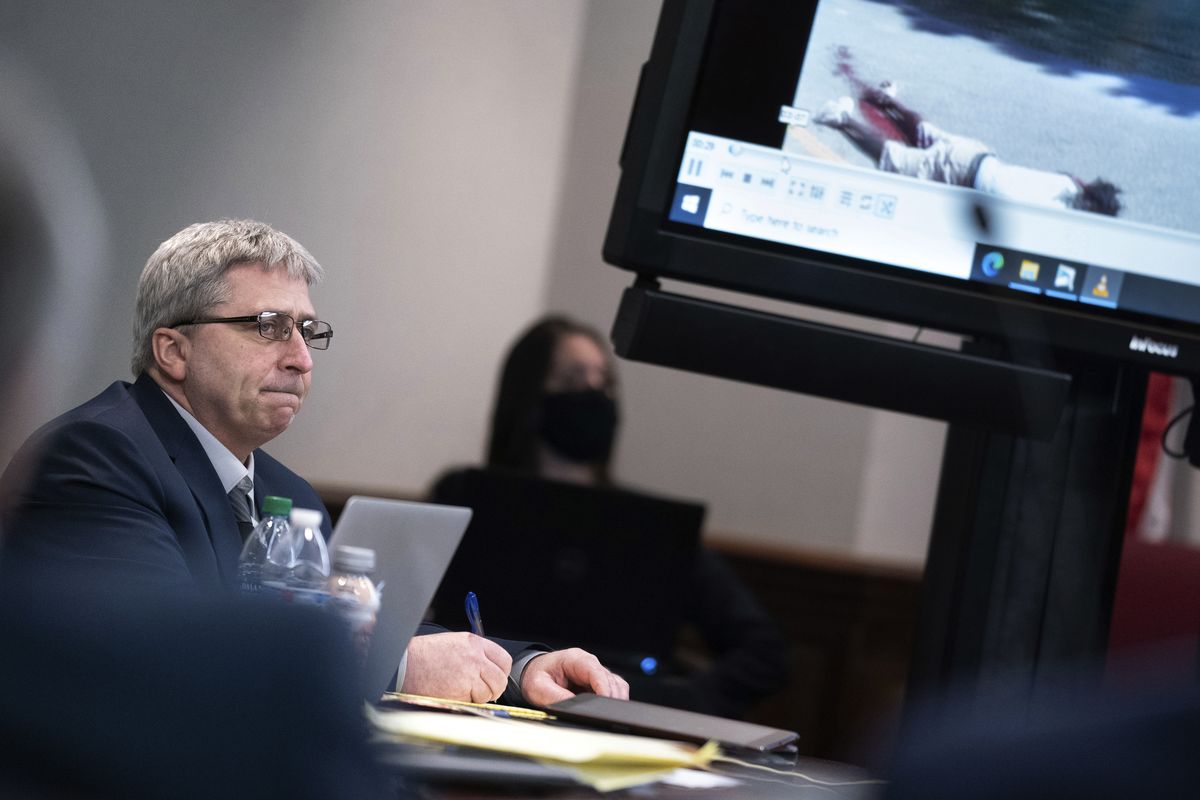 Defendant William "Roddie" Bryan listens to an attorney as police body camera footage is shown during trial at the Glynn County Courthouse, Monday, Nov. 8, 2021, in Brunswick, Ga. Greg McMichael and his son Travis McMichael and their neighbor Bryan are charged with the February 2020 slaying of 25-year-old Ahmaud Arbery.  (Sean Rayford)