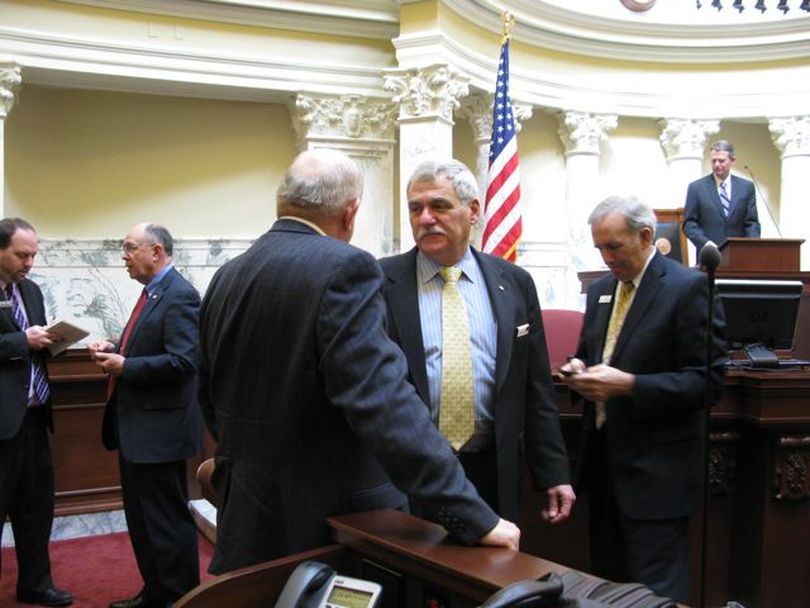Sen. John Goedde, R-Coeur d'Alene, center, visits with other senators shortly after the Senate adjourned for the year on Thursday. (Betsy Russell)