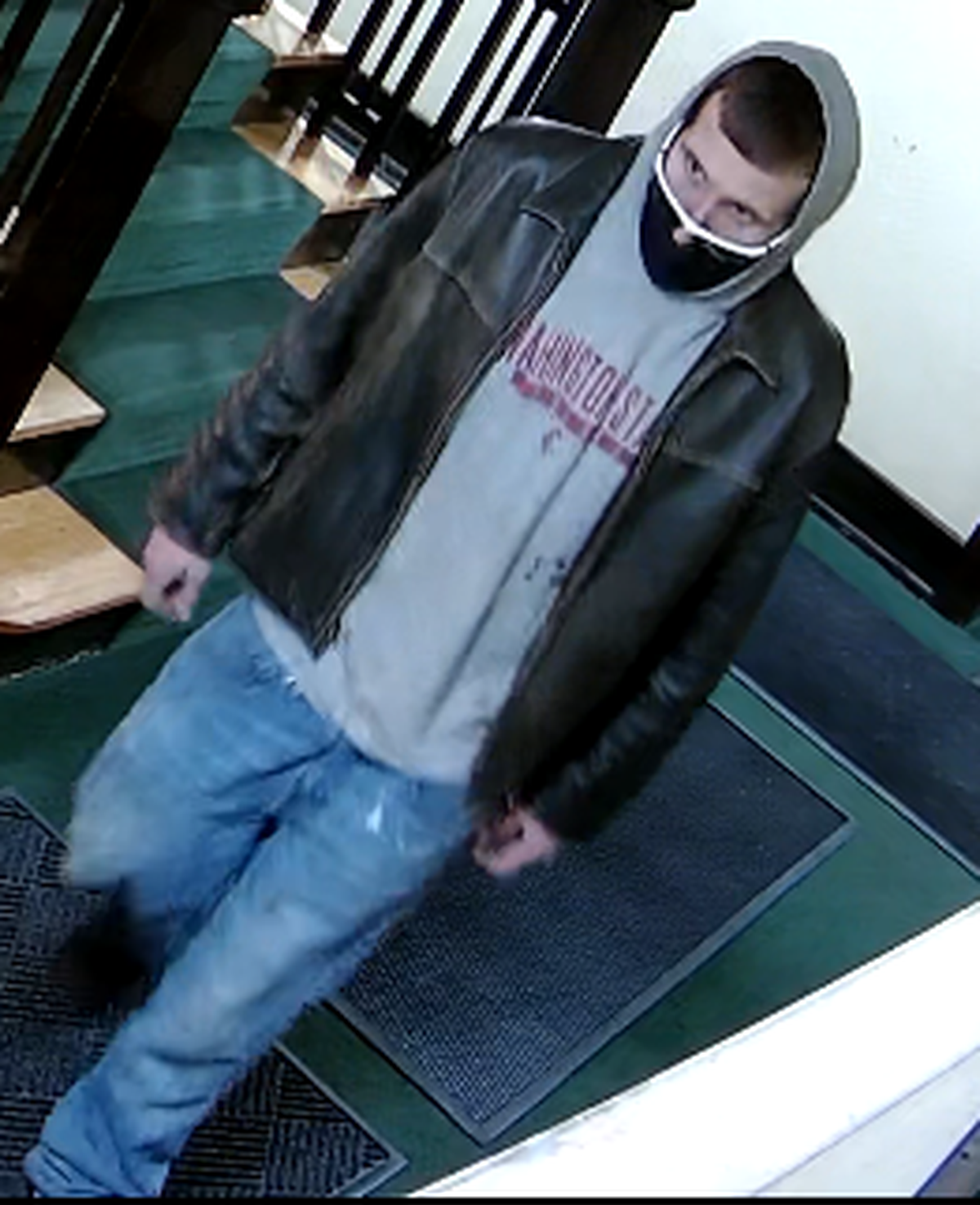 The Spokane Police Department is seeking information regarding the identity of this man, who police said used a crowbar to break into an apartment building on the 700 block of South Bernard Street.  (Courtesy of the Spokane Police Department)
