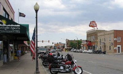 
Motorcycles are shown parked along the main street in downtown Cody, Wyo., last month. Not everyone in Cody is excited about an upcoming Hells Angels visit.
 (Associated Press / The Spokesman-Review)