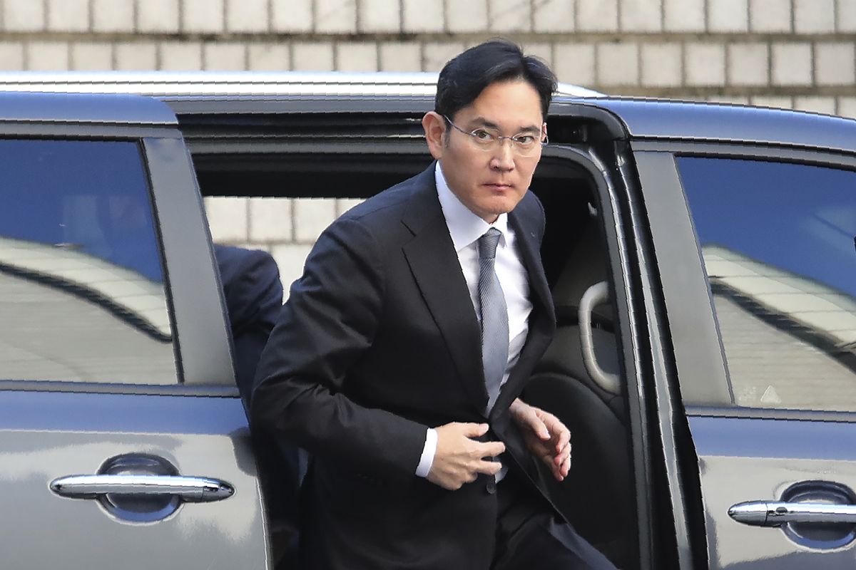FILE - In this Nov. 22, 2019, file photo, Samsung Electronics Vice Chairman Lee Jae-yong gets out of a car at the Seoul High Court in Seoul, South Korea. In an announcement by Seoul’s Justice Ministry on Monday, Aug. 9, 2021, South Korea will release billionaire Lee on parole this week after he spent 18 months in prison for his role in a massive corruption scandal that triggered nationwide protests and ousted the country’s previous president.  (Ahn Young-joon)