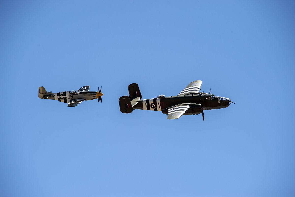A vintage P-511 and a B-25 entertain the crowds gathered at Fairchild Skyfest, July 29, 2017. (Dan Pelle / The Spokesman-Review)