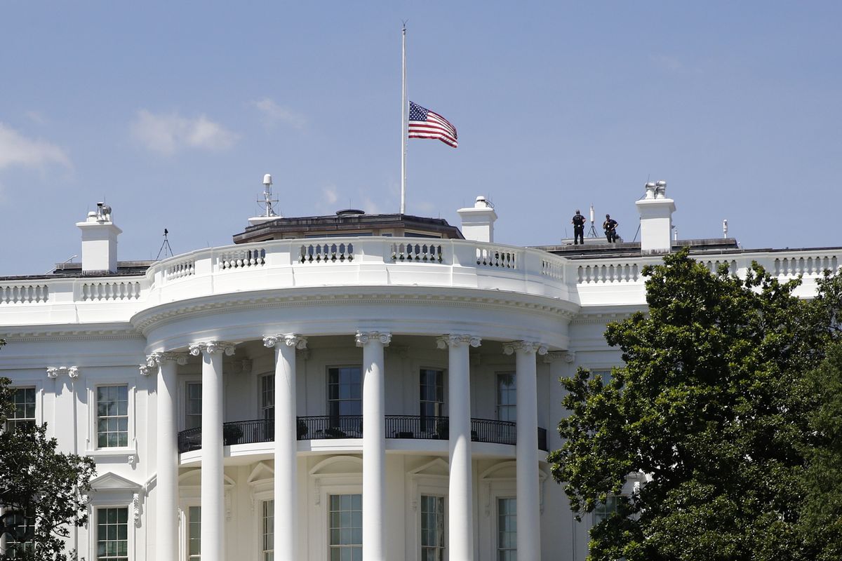 FILE - In this July 18, 2020, file photo, a U.S. flag flies at half-staff over the White House in Washington in remembrance of Rep. John Lewis, D-Ga. President Donald Trump did not pay his respects when Lewis lay in state in the Capitol Rotunda. Iwas another break in convention for a president who has broken so many norms, and one that underscored his separation from much of Washington society, along with his dismal relationship with Democrats on Capitol Hill — especially members of color. (Patrick Semansky)