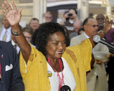 Freedom Rider Catherine Burks-Brooks raises her hands in joy during the opening ceremony of the Freedom Riders Museum in Montgomery, Ala., on Friday. (Associated Press)