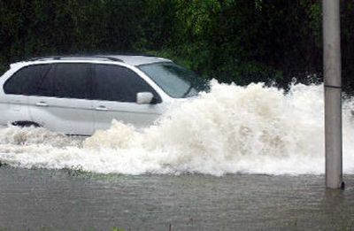 
A car navigates through floodwaters in Kingston, Jamaica on Monday. 
 (Associated Press / The Spokesman-Review)