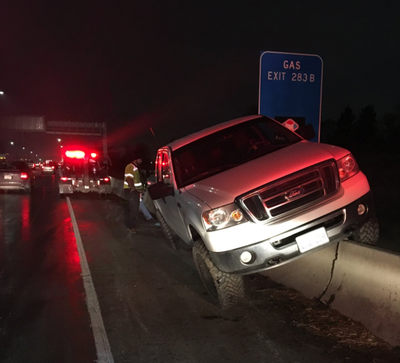 A truck headed westbound on Interstate 90 slid and crashed into a guardrail Tuesday, Dec. 12, 2017. Trooper Jeff Sevigney, spokesman for the Washington State Patrol, said the truck was driving too fast for icy conditions. (Washington State Patrol / Courtesy photo)