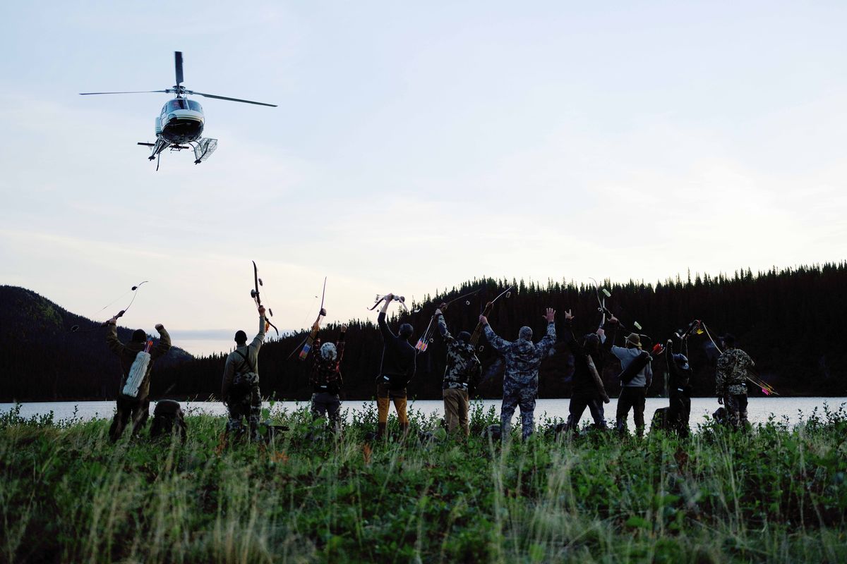 Contestants on Season 9 of the survival show “Alone” wave goodbye to a helicopter in an undisclosed location in Labrador, Canada. (Brendan George Ko)