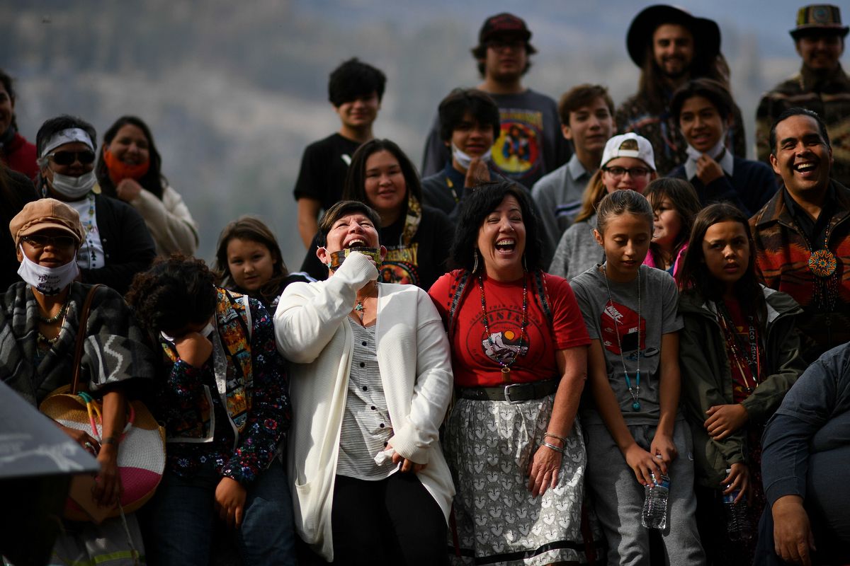 Linda Desautel, center in white, looks skyward and cheers with friends and Colville Confederated Tribe members as they rally in support of her husband Rick Desautel, whose case in the Canadian Supreme court arguing for the Sinixt peoples’ right to hunt traditional lands in Canada was first heard on Thursday near Kettle Falls, Wash.  (Tyler Tjomsland/THE SPOKESMAN-REVIEW)