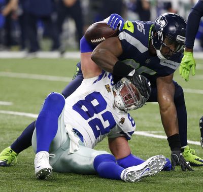 Dallas Cowboys tight end Jason Witten (82) is tackled after catching a pass by Seattle Seahawks defensive end Dion Jordan (95) in the second half of an NFL football game, Sunday, Dec. 24, 2017, in Arlington, Texas. (Michael Ainsworth / Associated Press)