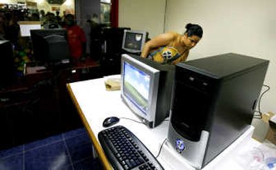 
A woman looks at a computer in a store in Havana on Friday. Associated Press
 (Associated Press / The Spokesman-Review)