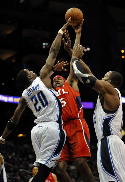 The Hawks’ Josh Smith shoots over Magic guard Mickael Pietrus.  (Associated Press)