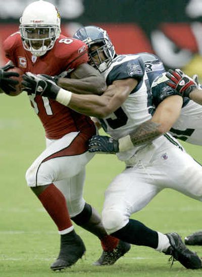 
Seattle's Darryl Tapp, right, can switch from DE to linebacker. Associated Press
 (Associated Press / The Spokesman-Review)