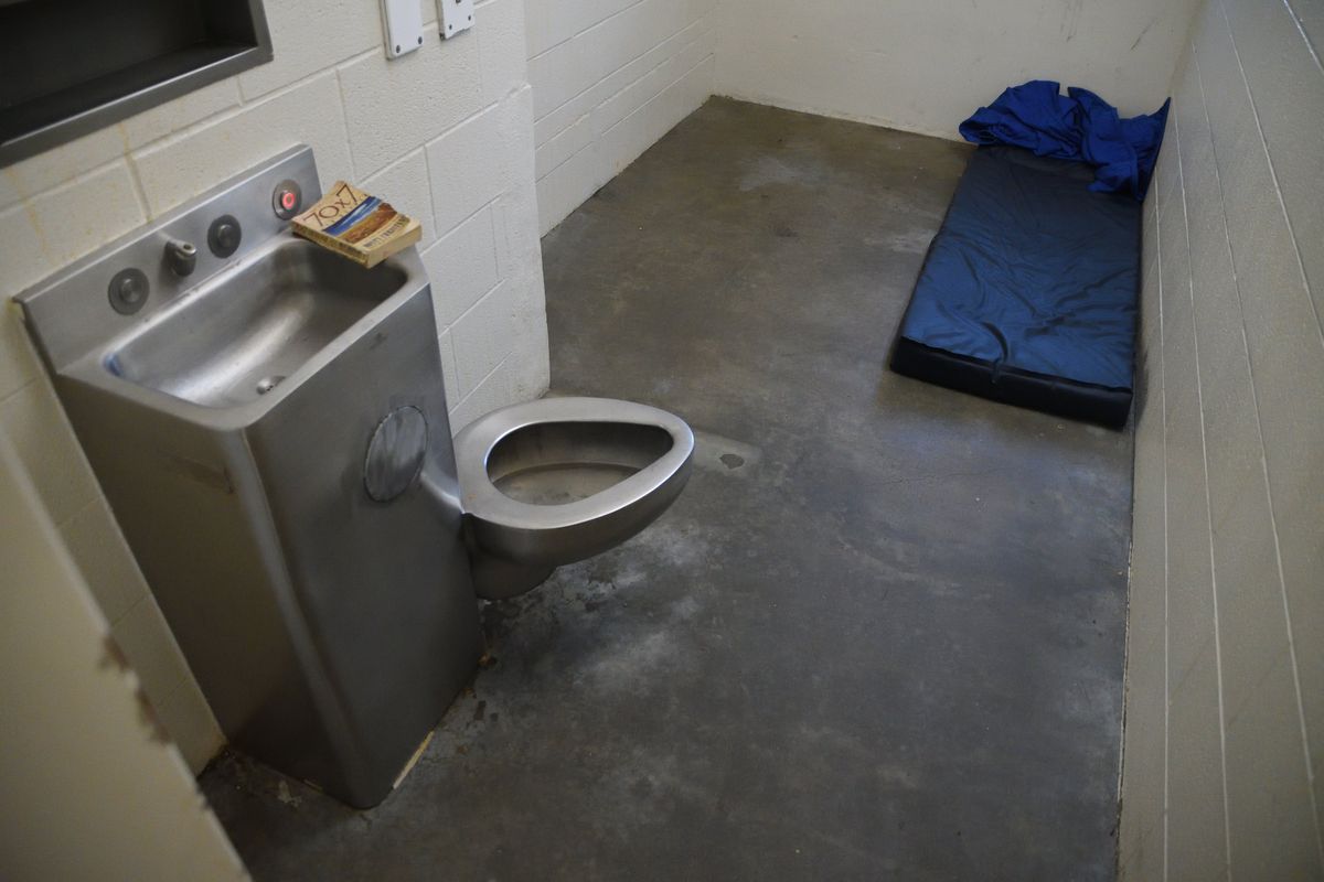 A cell in the Spokane County Jail is nearly empty Aug. 15, except for a mattress and a book.  (Colin Tiernan/The Spokesman-Review)