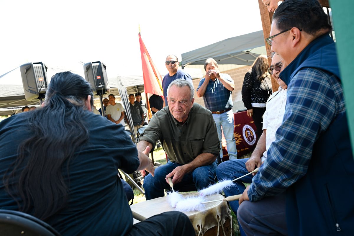 Health Secretary Robert F. Kennedy Jr. shakes hands after being invited to join in a drum circle during a visit to the Nez Perce Tribe on Thursday, Jul. 24, 2025, at the Nez Perce Tribal Hatchery Complex in Lenore, Id. (Tyler Tjomsland/The Spokesman-Review)