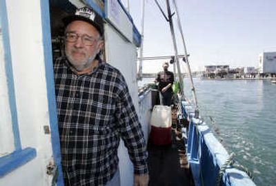 
Professional salmon fisherman Rusty Boro steers his boat Bebe in the dock in Half Moon Bay, Calif. earlier this month. Boro and other salmon fisherman are feeling the economic pinch from the low salmon runs this year.Associated Press
 (Associated Press / The Spokesman-Review)