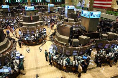 
Traders and specialists work the trading floor of the New York Stock Exchange in the afternoon hours Friday. Associated Press
 (Associated Press / The Spokesman-Review)