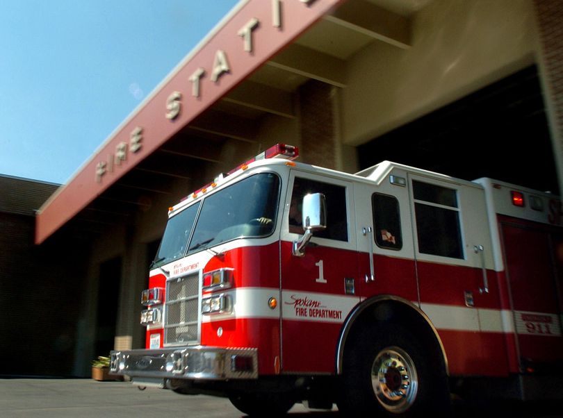 FILE - A Spokane Fire Department fire engine pulls away from Station No. 1 in downtown Spokane in August 2007. (INGRID BARRENTINE / SR)