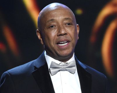 In this Feb. 6, 2015, file photo, hip-hop mogul Russell Simmons presents the Vanguard Award on stage at the 46th NAACP Image Awards in Pasadena, Calif. (Chris Pizzello / Associated Press)