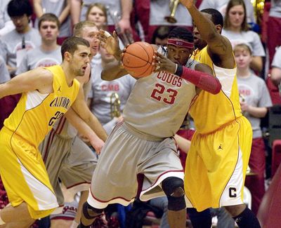 Washington State forward DeAngelo Casto (23) fights for position while defended by California center Markhuri Sanders-Frison, right, as forward Harper Kamp moves to help during the first half of their game on Feb. 12, 2011. (Dean Hare / Fr158448 Ap)