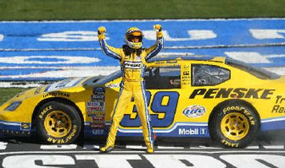 
Kurt Busch plays to the crowd after winning the O'Reilly 300.
 (Associated Press / The Spokesman-Review)