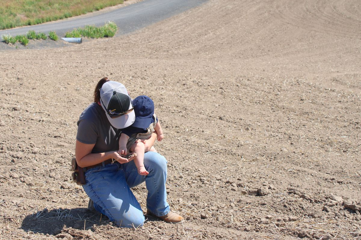 Alicia Zeiler and her 8-month-old daughter are seen at GMC Joint Venture in Harrington, Wash. (Monica Carrillo- Casas/The Spokesman-Review,)