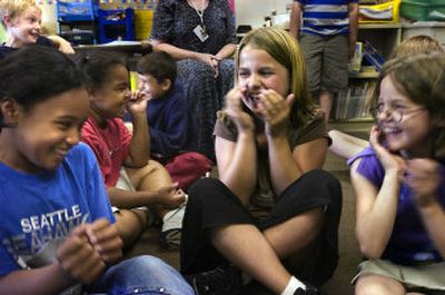 Chris Peters' third-grade class laughs Thursday at Garfield Elementary School. About 20 of Peters' students will be returning to Ridgeview after spending one year at Garfield while Ridgeview was being rebuilt. 
 (Jed Conklin / The Spokesman-Review)
