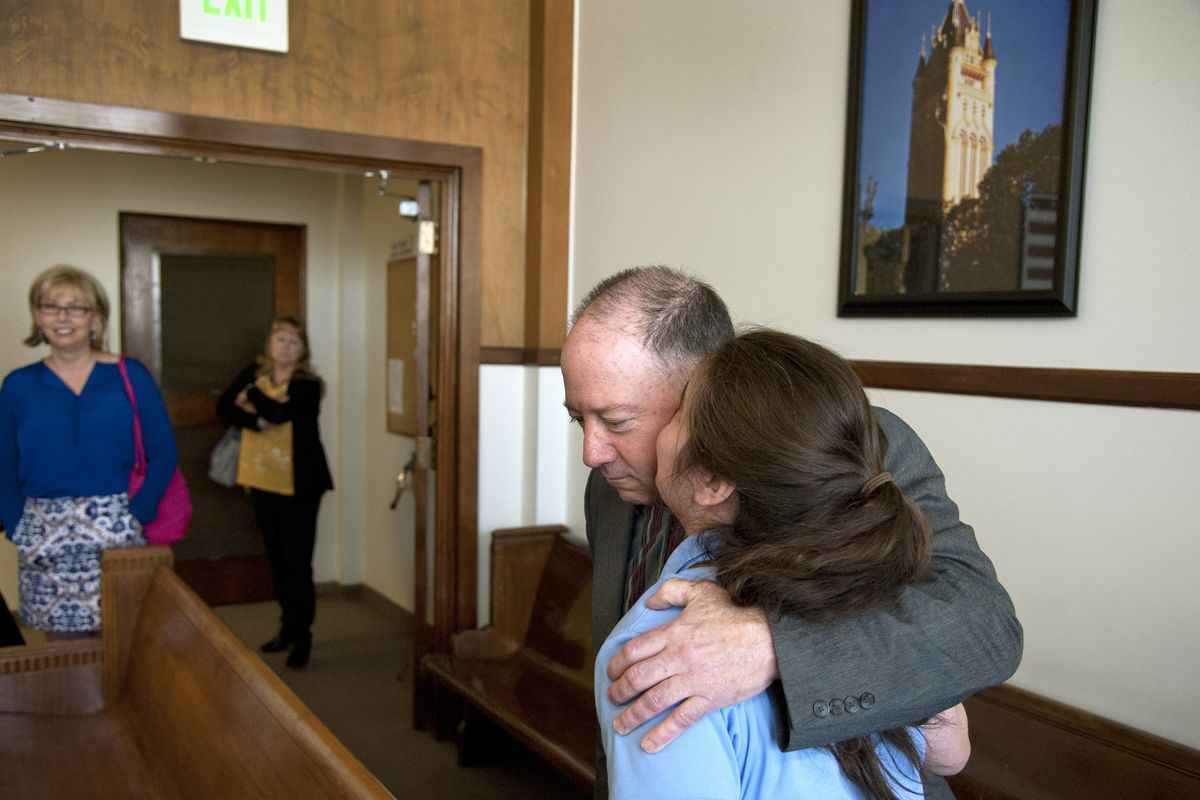 Gail Gerlach receives support from Andrea Goddard as he leaves Judge Annette Plese’s courtroom for a lunch break Tuesday. (Dan Pelle)