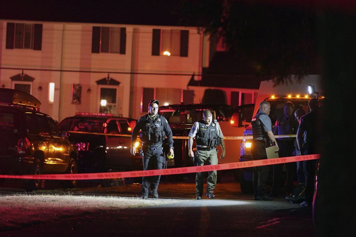 Police officials work at a scene where a man suspected of fatally shooting a supporter of a right-wing group in Portland, Ore., last week was killed as investigators moved in to arrest him in Lacey, Wash., Thursday, Sept. 3, 2020. Michael Reinoehl, 48, was killed as a federal task force attempted to apprehend him in Lacey, a senior Justice Department official said. Reinoehl was the prime suspect in the killing of 39-year-old Aaron “Jay” Danielson, who was shot in the chest Saturday night, the official said.  (Ted Warren)