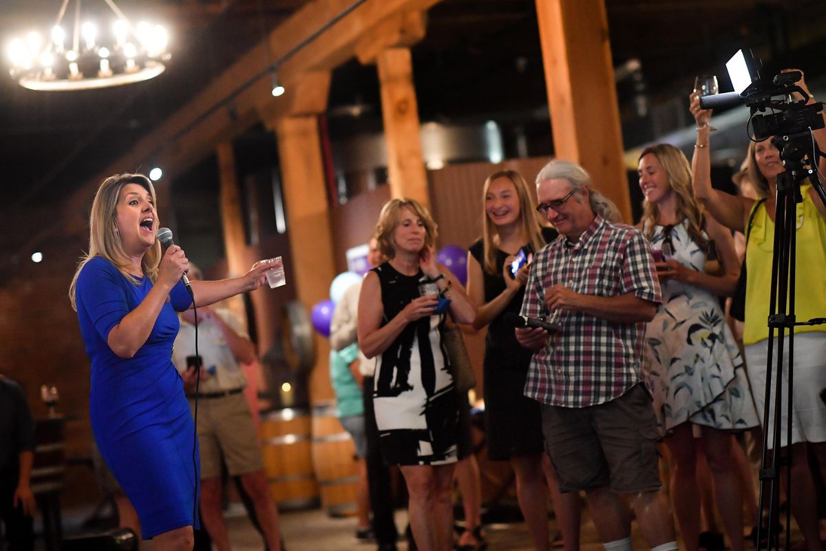 Spokane Mayoral candidate Nadine Woodward reacts with supporters as results come in during an election night watch party on Tuesday, Aug. 6, 2019, at Barrister Winery in Spokane, Wash. (Tyler Tjomsland / The Spokesman-Review)