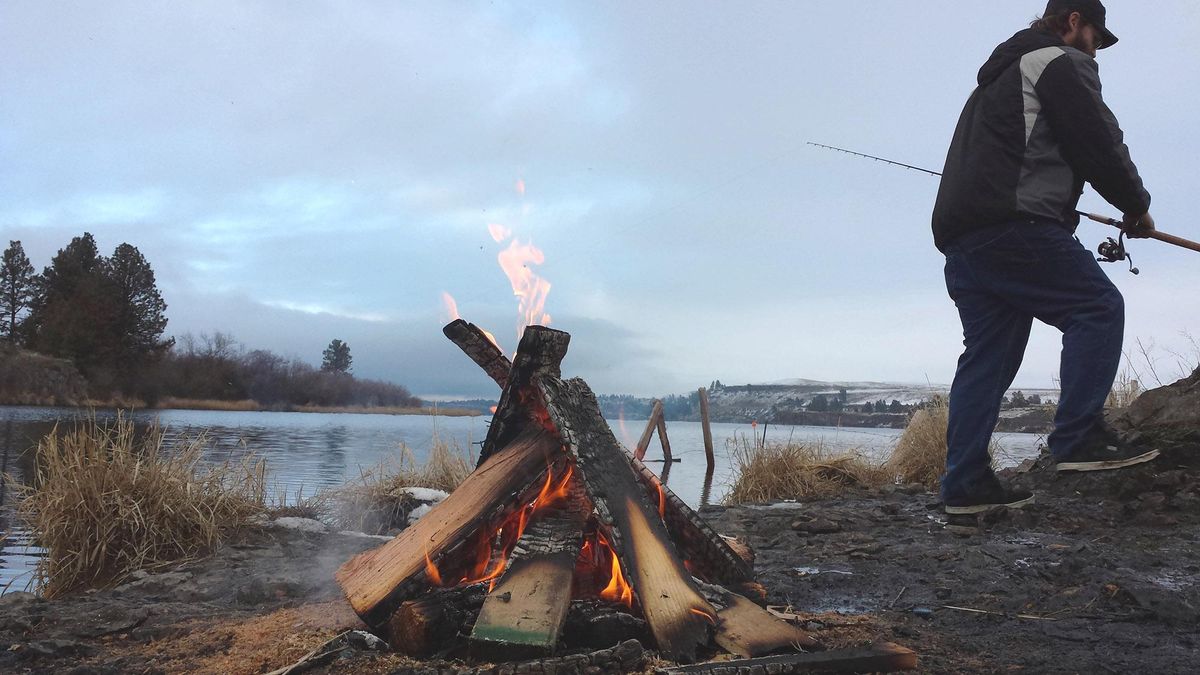 An angler fishes from shore on a wintry January day at Rock Lake in Whitman County. (Rich Landers / The Spokesman-Review)