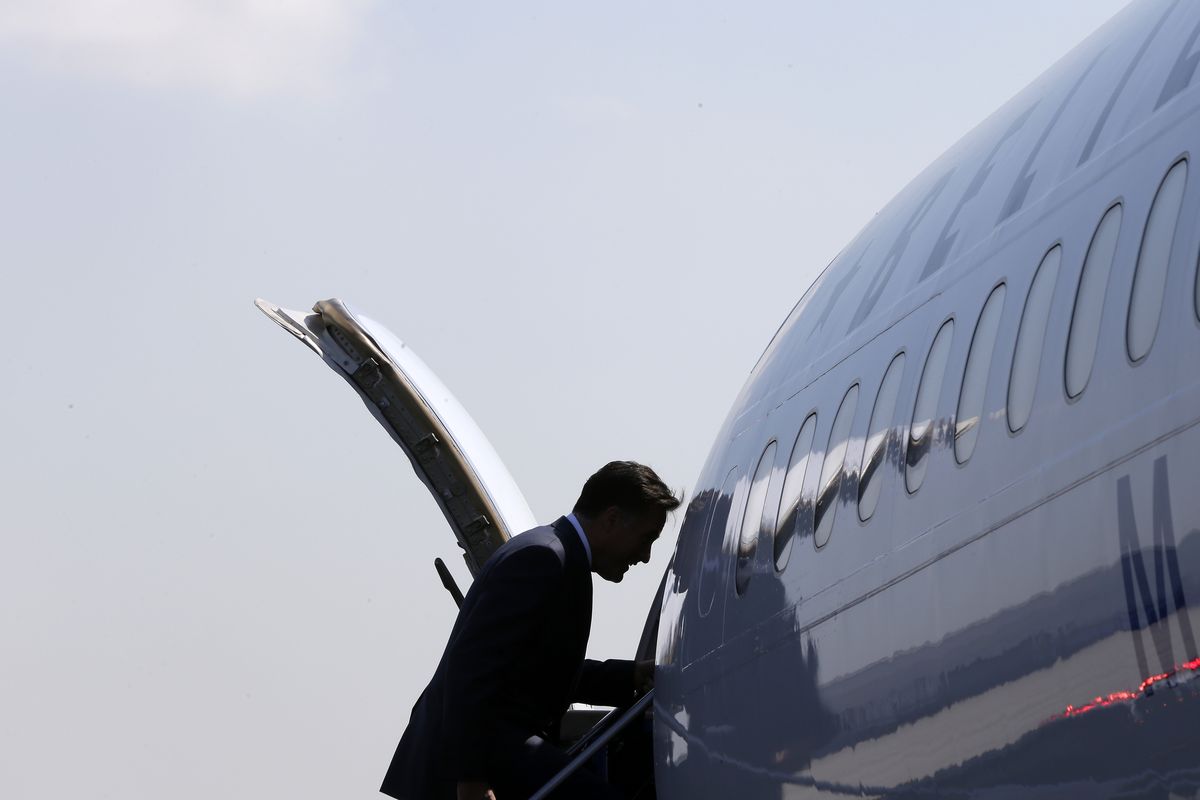 Republican presidential candidate, former Massachusetts Gov. Mitt Romney boards his campaign charter plane in Newark, N.J., Friday, Sept. 14, 2012. (Charles Dharapak / Associated Press)