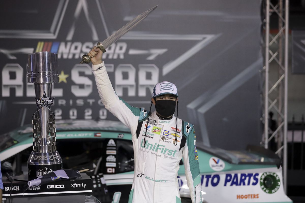 Chase Elliott celebrates with the trophy after winning a NASCAR All-Star auto race at Bristol Motor Speedway in Bristol, Tenn, Wednesday, July 15, 2020.  (Associated Press)