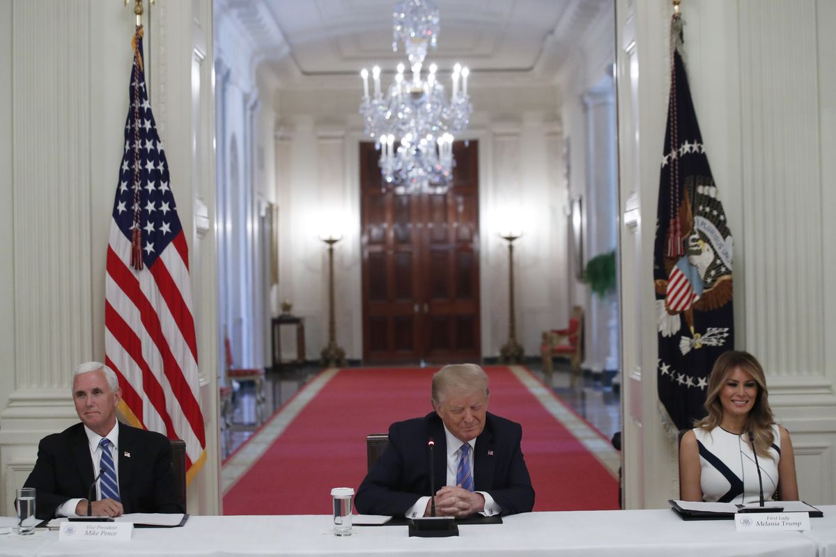 President Donald Trump, Vice President Mike Pence, left, and first lady Melania Trump, attend a "National Dialogue on Safely Reopening America