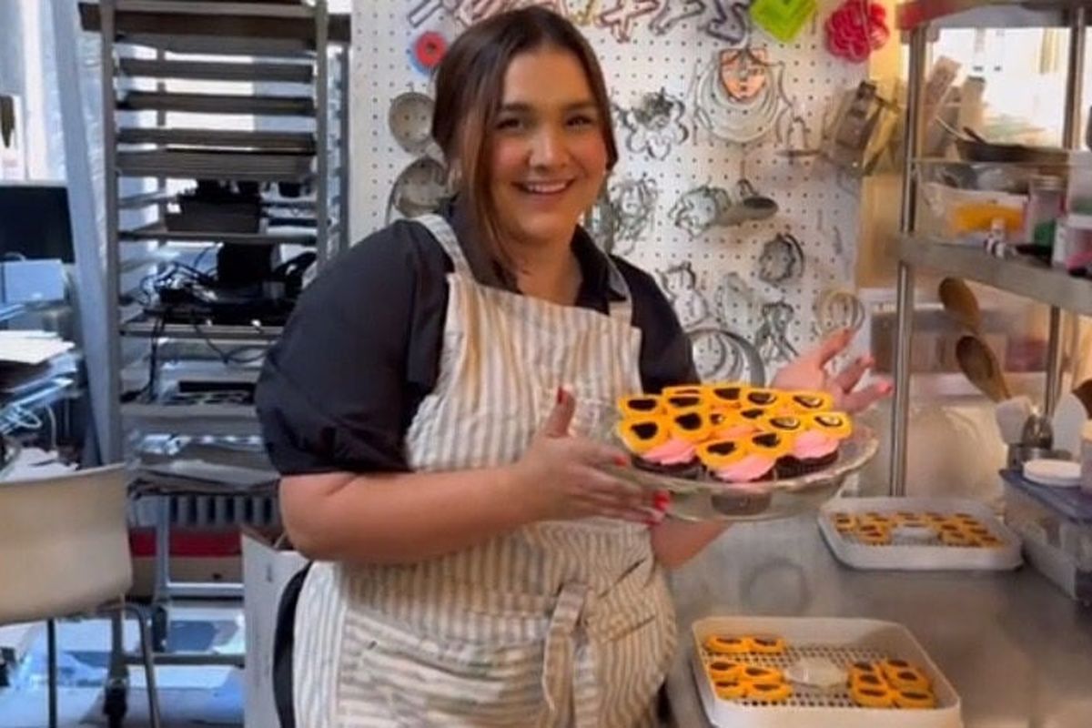 Emma Irvine, the owner of Sweet Something, baked sugar cookies in the shape of orange sunglasses to joke about the burglar. MUST CREDIT: Emma Irvine/TikTok  (Emma Irvine/TikTok/Handout)