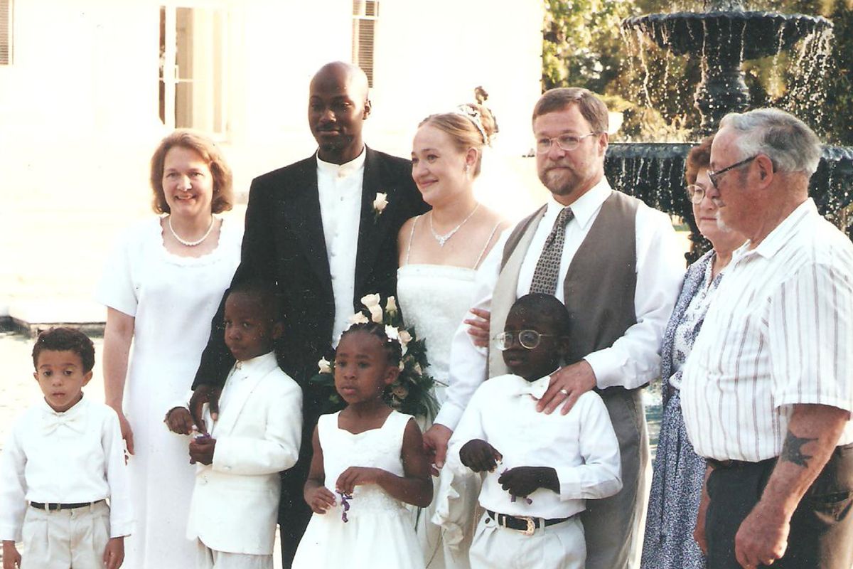 Rachel Dolezal poses for a photo with her family during her wedding reception in May 2000 in Jackson, Miss. Dolezal has since divorced Kevin Moore. Pictured, back left to right, are Rachel’s mother Ruthanne Dolezal, Moore, Rachel Dolezal, Larry Dolezal (Rachel’s father), Peggy and Herman Dolezal (Rachel’s grandparents). Front row, left to right, are Ezra, Izaiah, Esther and Zachariah, Ruthanne and Larry Dolezal’s adopted children.