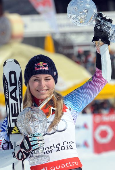 Lindsey Vonn shows the trophies of her two Women’s World Cup discipline titles.  (Associated Press)