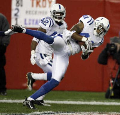 
Colts' Antoine Bethea (41) collects the first of four interceptions thrown by Tom Brady. 
 (Associated Press / The Spokesman-Review)