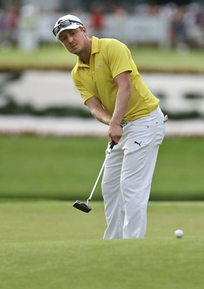 Jonas Blixt, of Sweden, watches his putt roll toward the cup on the 18th hole during the final round of the Greenbrier Classic. (Associated Press)