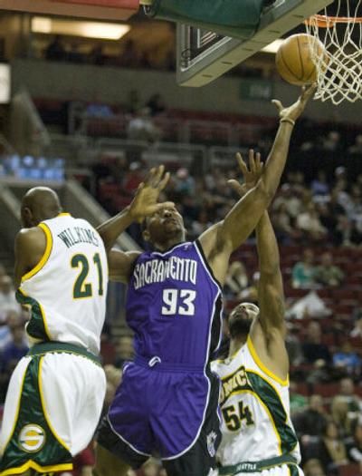 
Ron Artest splits Seattle's Damien Wilkens and Chris Wilcox while going to the basket.Associated Press
 (Associated Press / The Spokesman-Review)