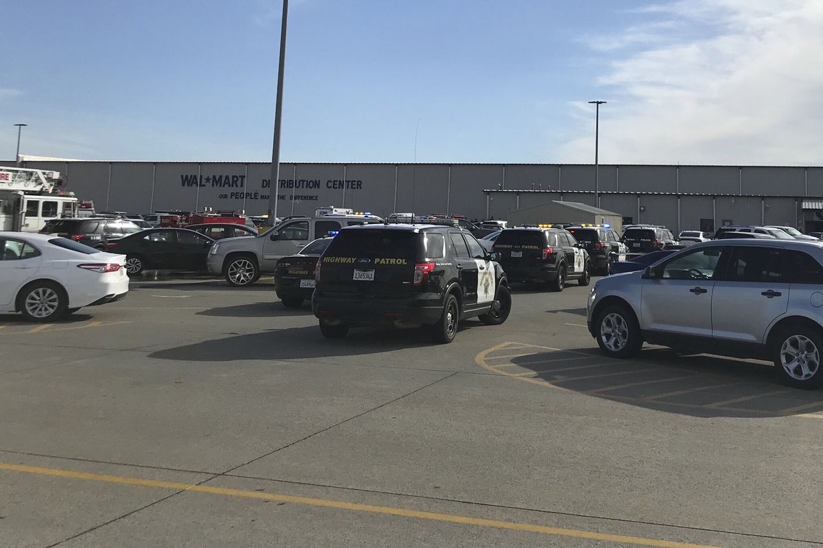 Law enforcement vehicles are seen at the Red Bluff Walmart distribution center after a shooting, Saturday, June 27, 2020, in Red Bluff, Calif.  (Damon Arthur)