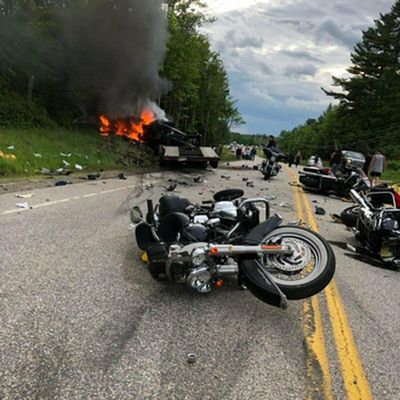This photo provided by Miranda Thompson shows the scene where several motorcycles and a pickup truck collided on a rural, two-lane highway Friday, June 21, 2019 in Randolph, N.H.  New Hampshire State Police said a 2016 Dodge 2500 pickup truck collided with the riders on U.S. 2 Friday evening. The cause of the deadly collision is not yet known. The pickup truck was on fire when emergency crews arrived.  (Miranda Thompson via AP) (AP)