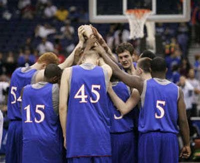 KU players huddle at practice Associated Press
(Associated Press / The Spokesman-Review)