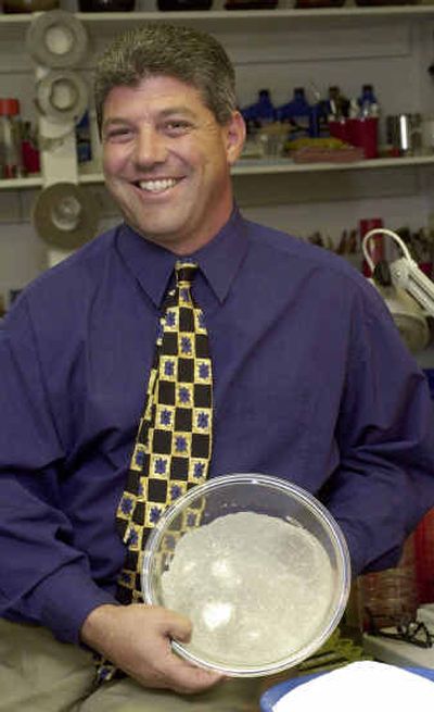
Peter Cordani of Dyn-O-Mat holds a bowl showing how his product 