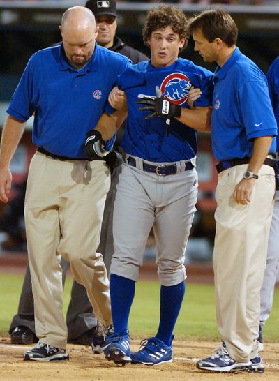 Adam Greenberg is helped off the field after being beaned in his only MLB at-bat on July 9, 2005. (Associated Press)