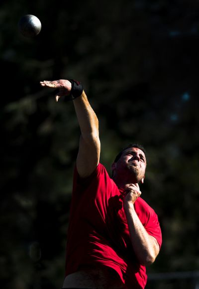 Kirk Unland, a Ferris shot, discus and hammer thrower, practices the shot put on Tuesday at Ferris High School. (Colin Mulvany / The Spokesman-Review)