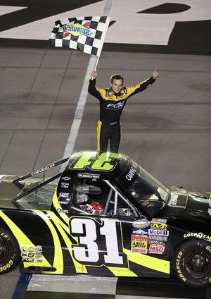 James Buescher driver of the #31 Fraternal Order of Eagles Chevrolet celebrates after winning the NASCAR Camping World Truck Series Kentucky 201 at Kentucky Speedway on September 21, 2012 in Sparta, Kentucky. (Photo Credit: Andy Lyons/Getty Images for NASCAR) (Andy Lyons / Getty Images North America)