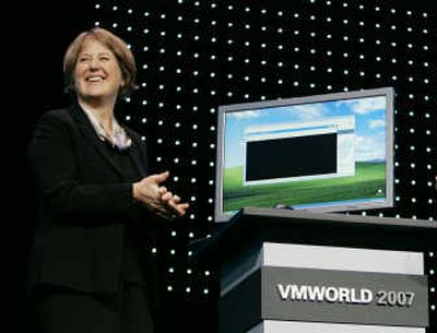 
Diane Greene, CEO of VMware Inc. smiles after showing a virtualization demo with the new ESX3i during her keynote address at the VMworld 2007 conference in San Francisco on Tuesday.Associated Press
 (Associated Press / The Spokesman-Review)